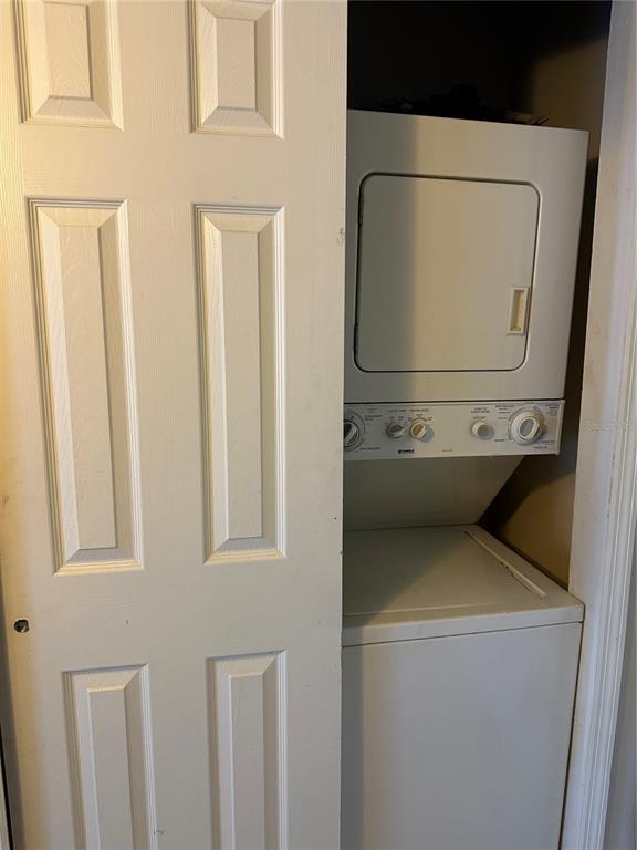 1695 Lee Road, Unit C110 Winter Park, FL 32789 - Photo 9 of 16 a utility room with dryer and washer