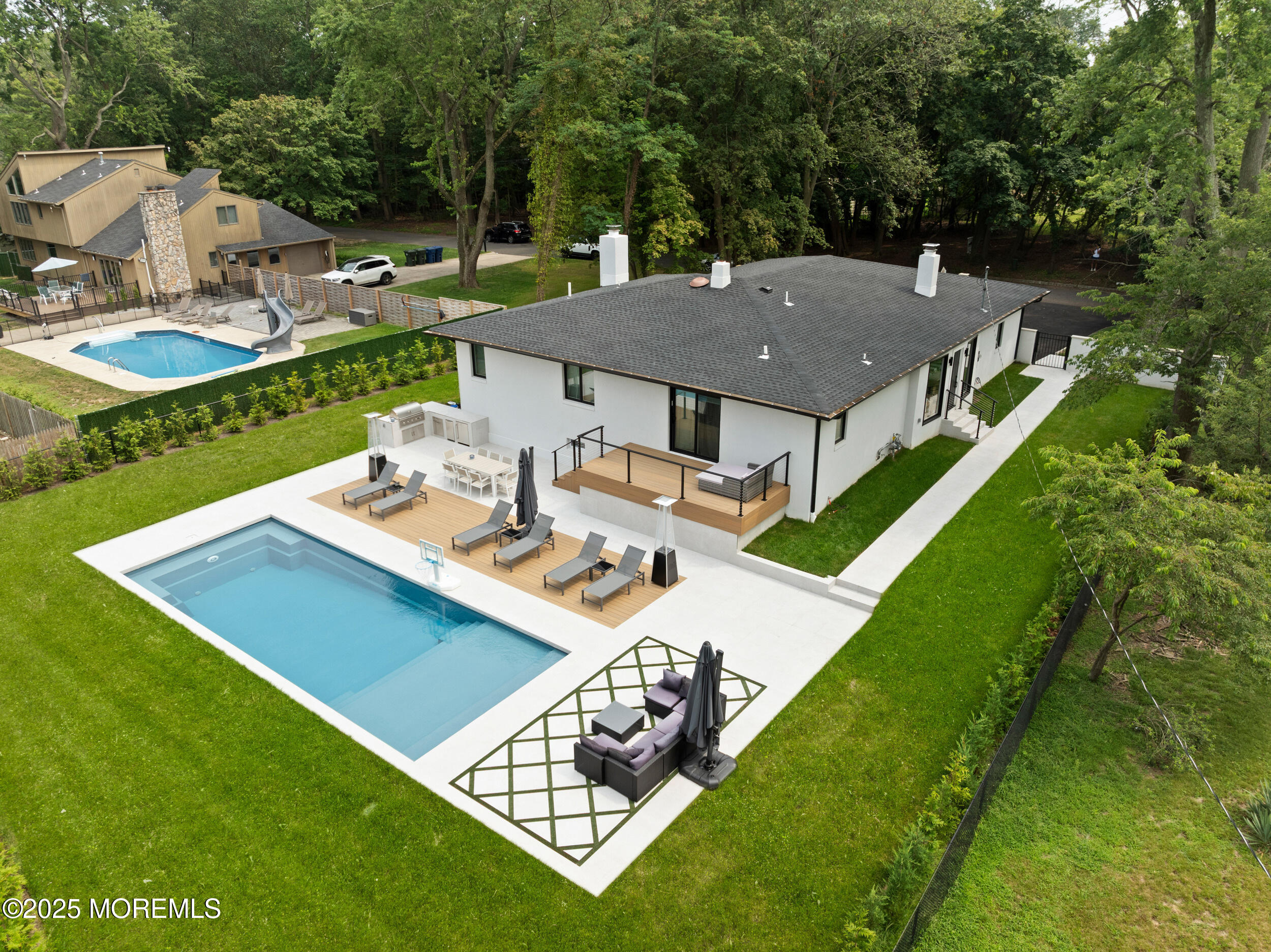 441 Slocum Place Oakhurst, NJ 07755 - Photo 1 of 61 a view of a house with pool and chairs
