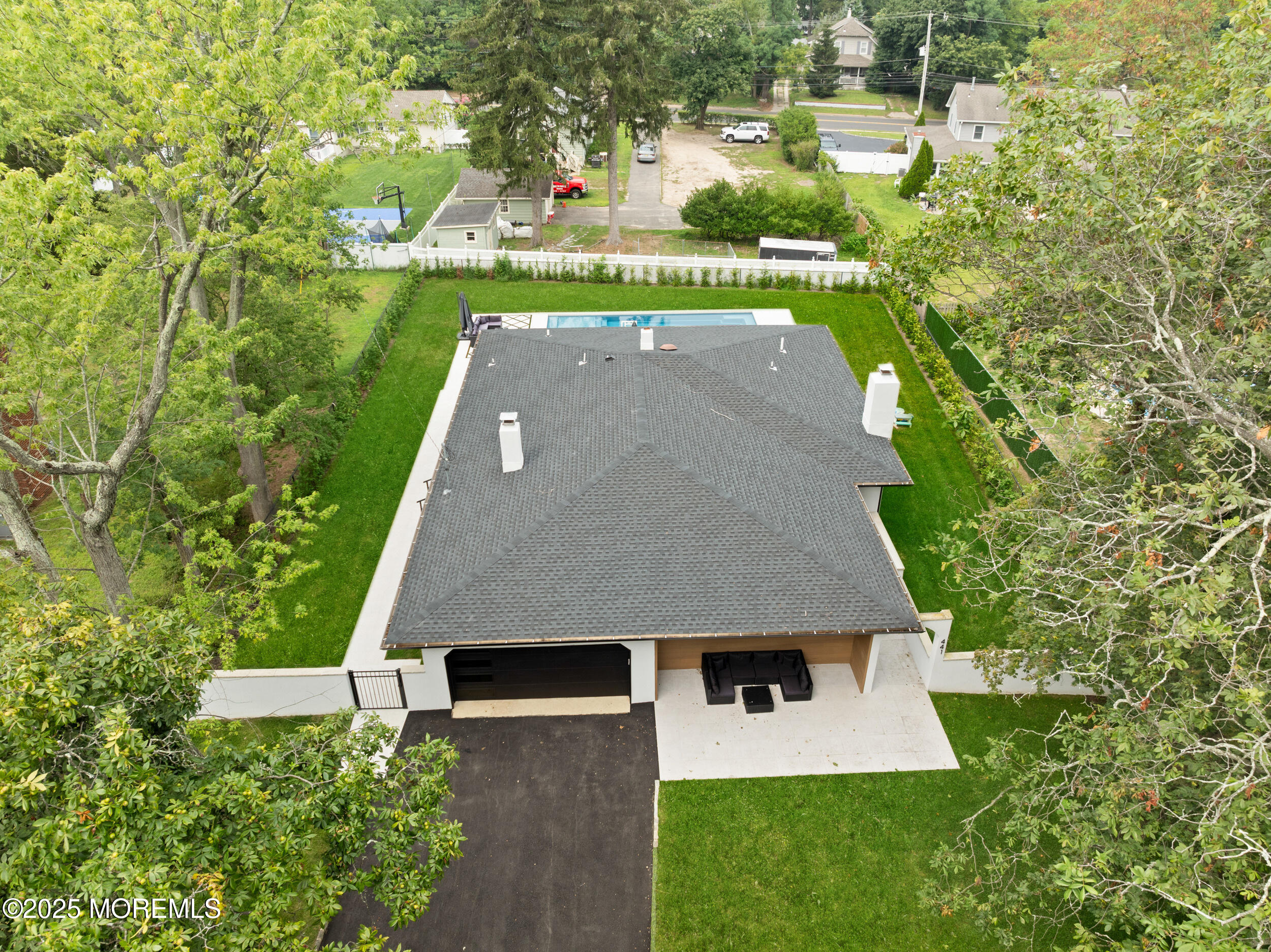 441 Slocum Place Oakhurst, NJ 07755 - Photo 3 of 61 an aerial view of a house with a yard and lake view