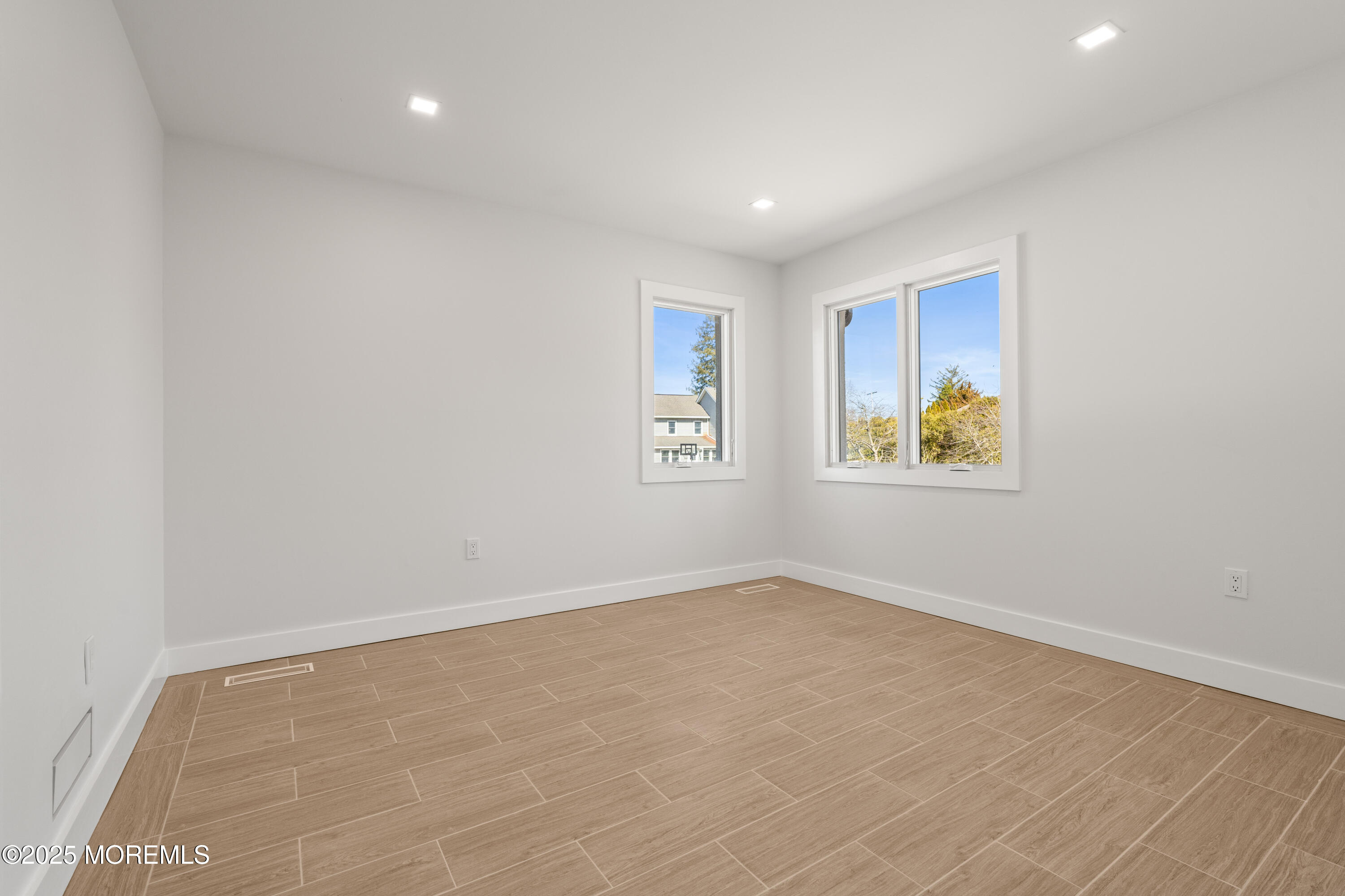 441 Slocum Place Oakhurst, NJ 07755 - Photo 31 of 61 an empty room with windows