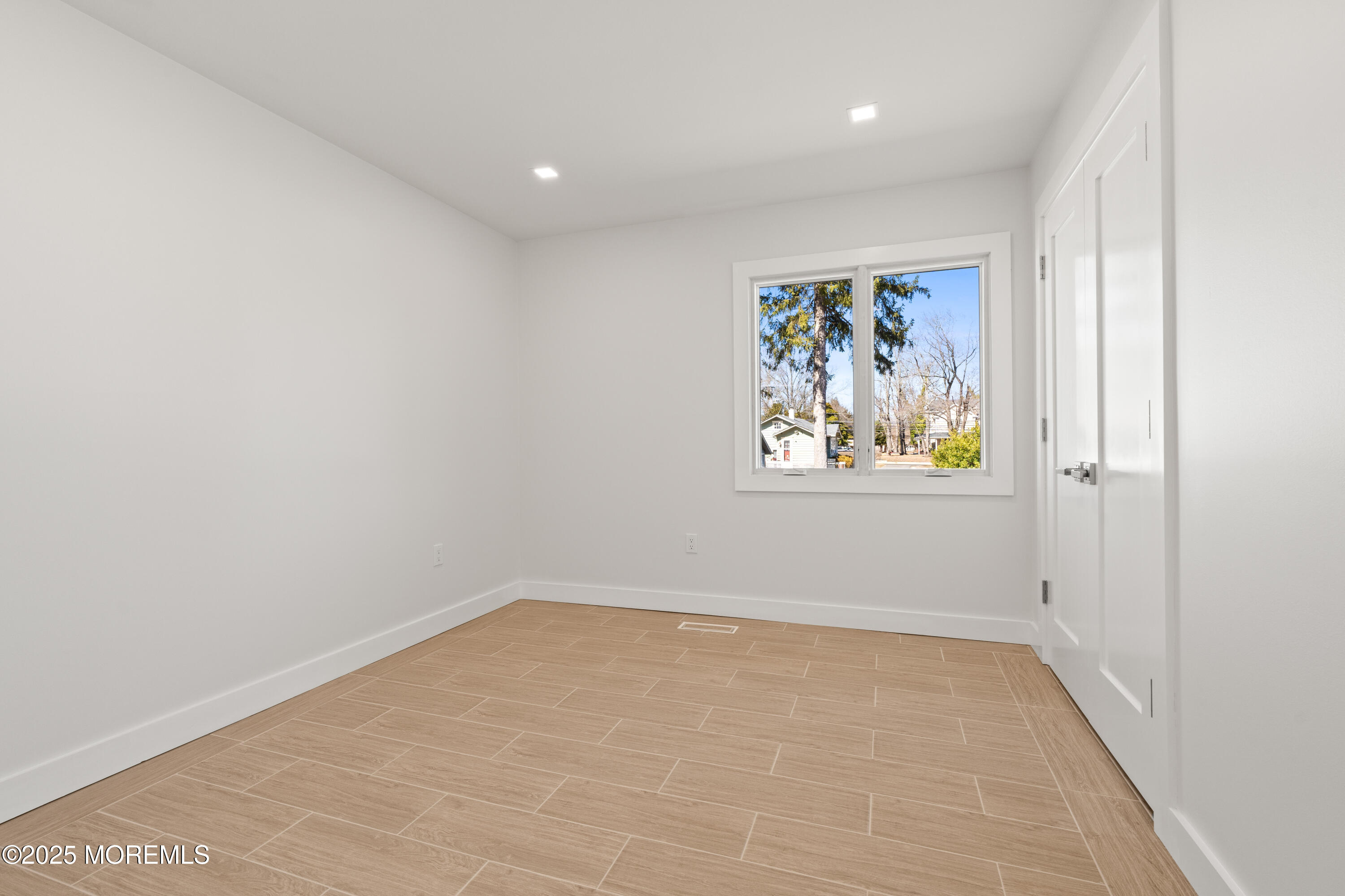 441 Slocum Place Oakhurst, NJ 07755 - Photo 33 of 61 an empty room with painting on the wall