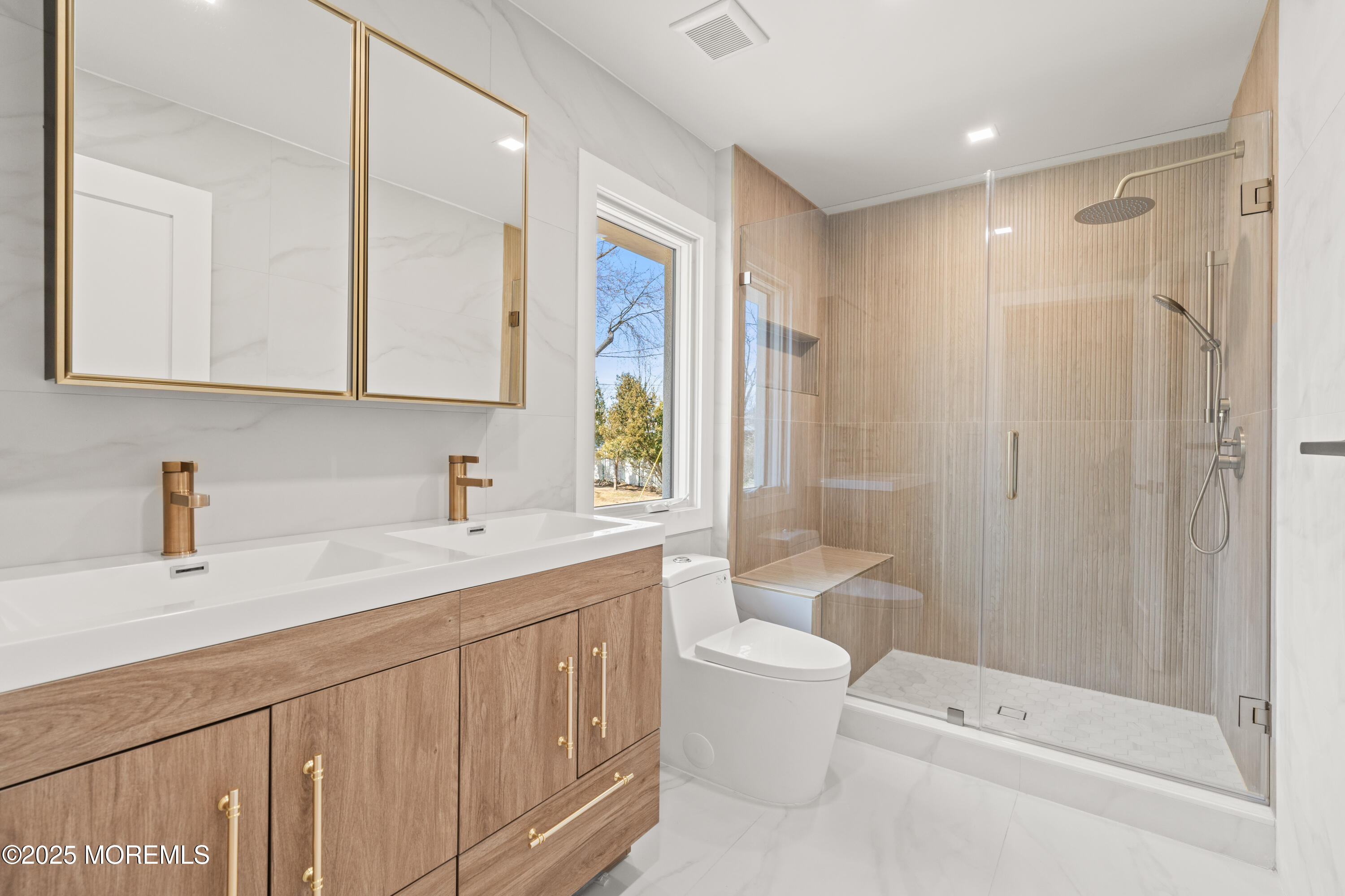 441 Slocum Place Oakhurst, NJ 07755 - Photo 37 of 61 a bathroom with a sink a toilet and shower