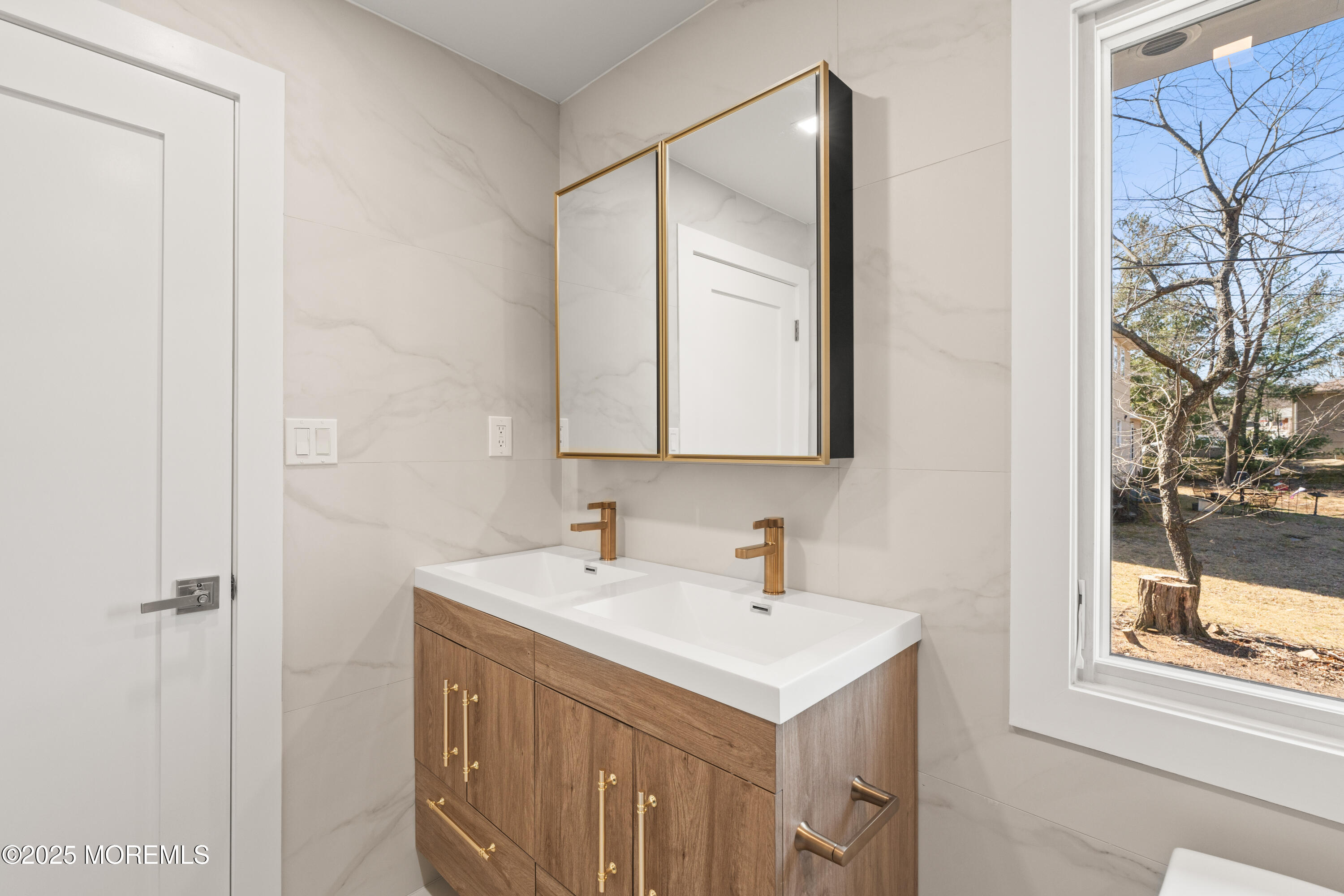 441 Slocum Place Oakhurst, NJ 07755 - Photo 39 of 61 a bathroom with a sink and a mirror