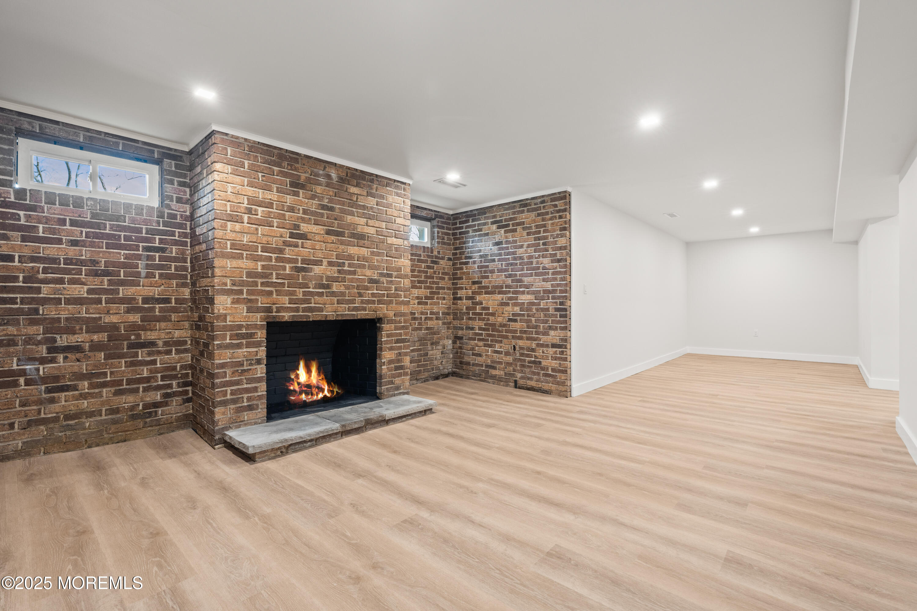 441 Slocum Place Oakhurst, NJ 07755 - Photo 45 of 61 a view of an empty room with a fireplace