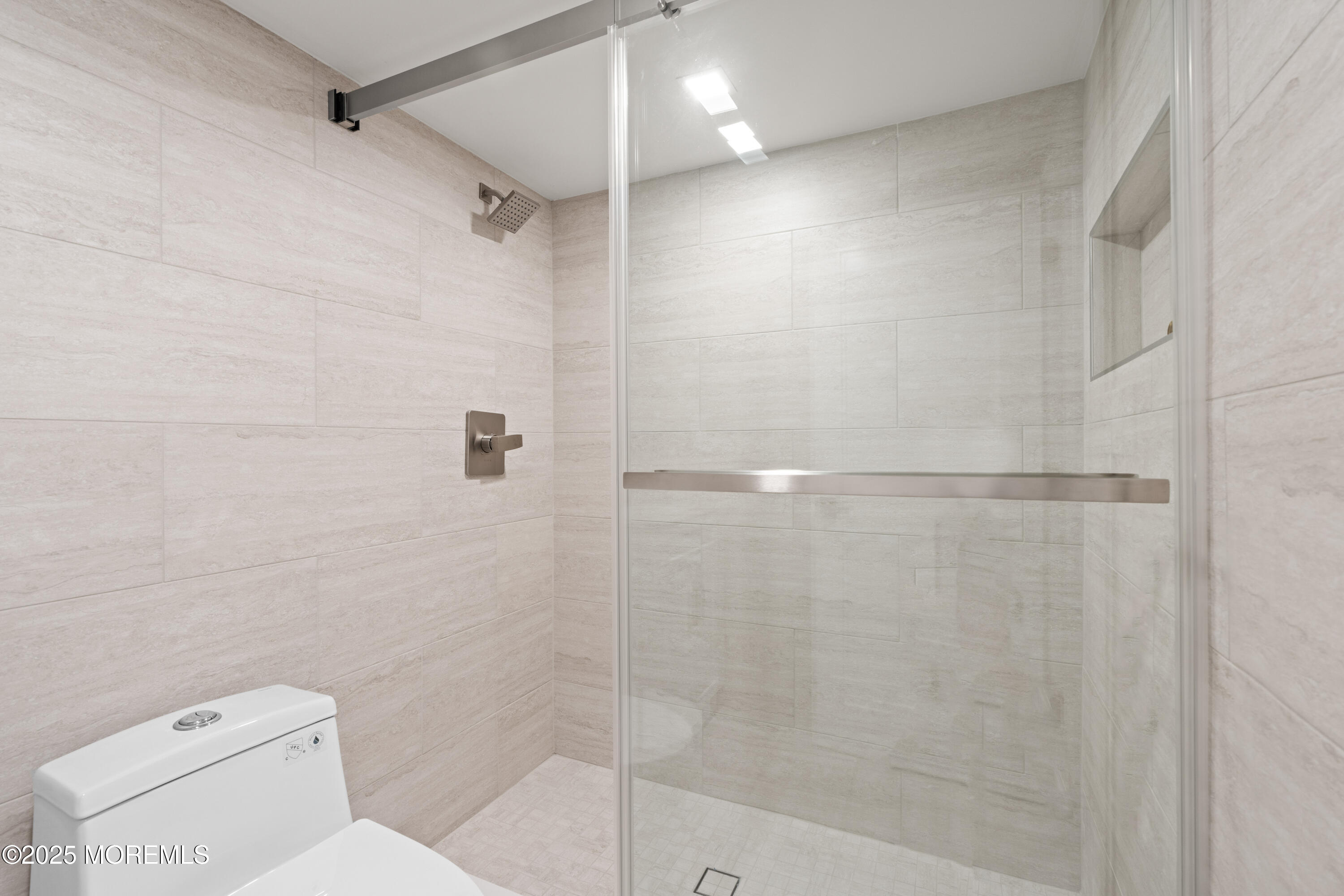 441 Slocum Place Oakhurst, NJ 07755 - Photo 47 of 61 a bathroom with a toilet and a shower