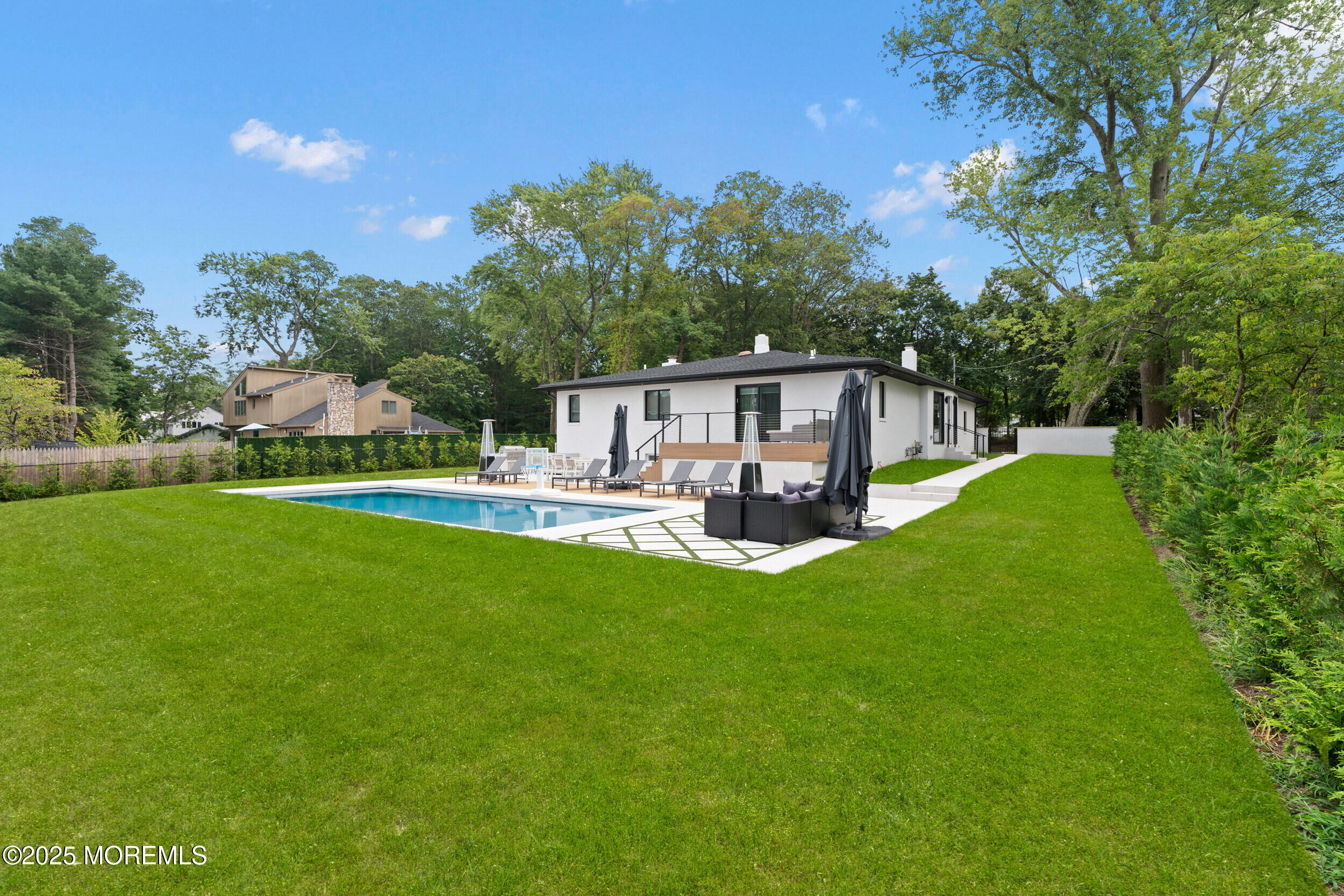 441 Slocum Place Oakhurst, NJ 07755 - Photo 57 of 61 a view of house with swimming pool and garden
