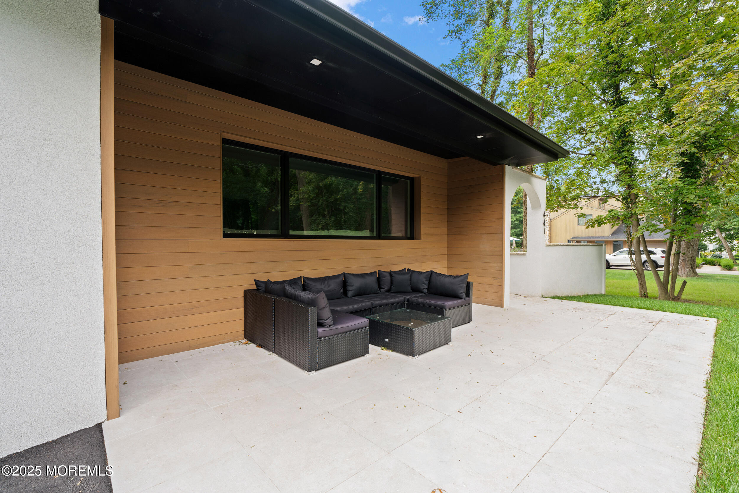 441 Slocum Place Oakhurst, NJ 07755 - Photo 7 of 61 a terrace of a house with outdoor seating