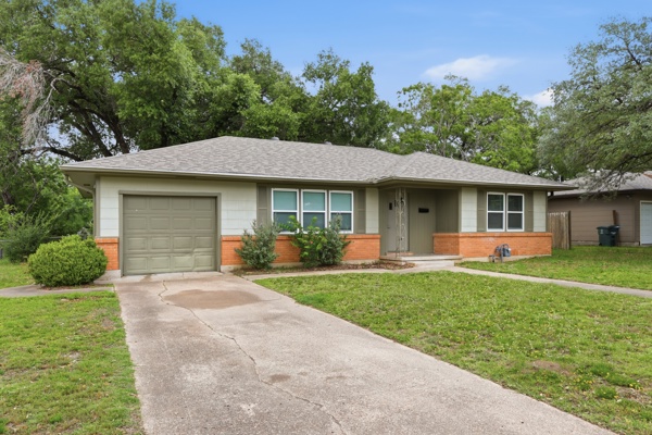 1608 Burt Street Bryan, TX 77802 - Photo 2 of 16 a front view of a house with a garden and porch