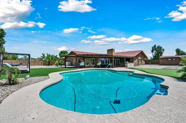 a view of outdoor space with playground and green space