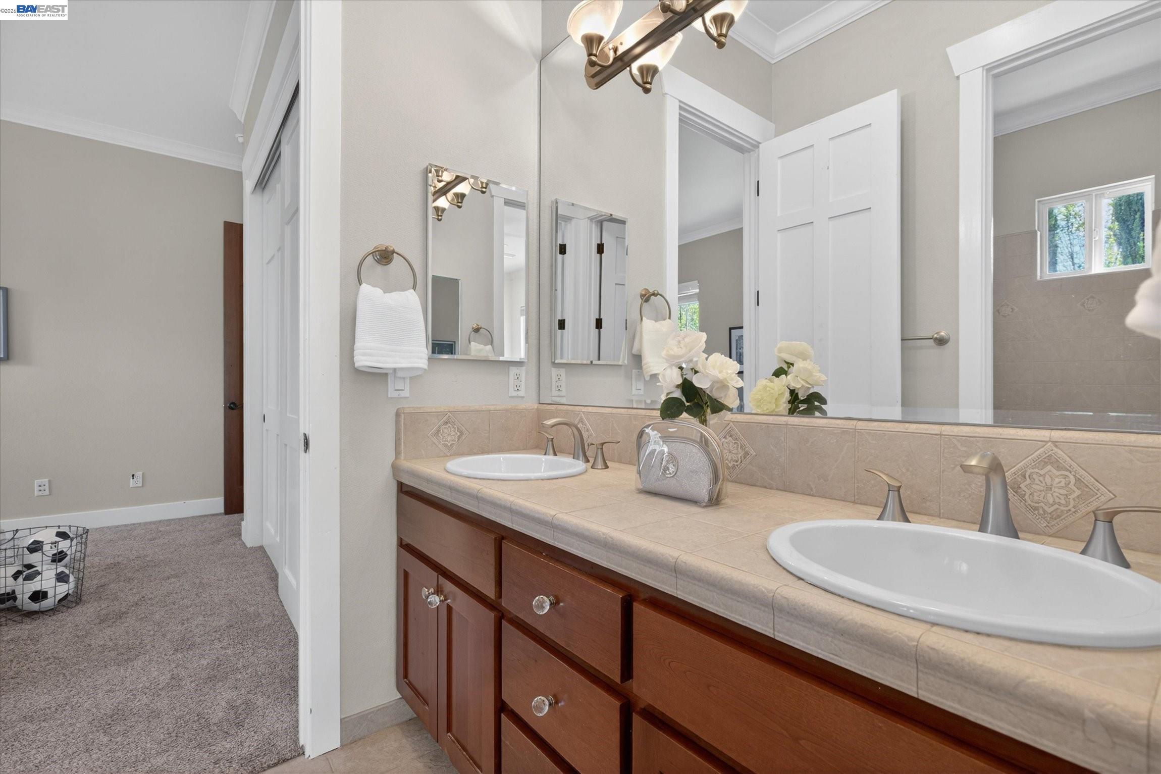 932 Hansen Road Livermore, CA 94550 - Photo 30 of 74 a bathroom with a sink double vanity and a mirror
