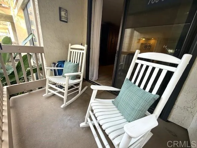 a view of living room with furniture and a window
