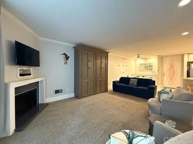 a bedroom with furniture and a flat screen tv