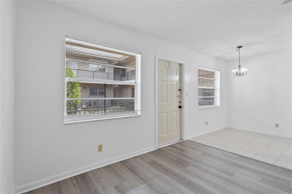 1230 Old Boynton Road, Unit 203 Boynton Beach, FL 33426 - Photo 11 of 25 an empty room with windows