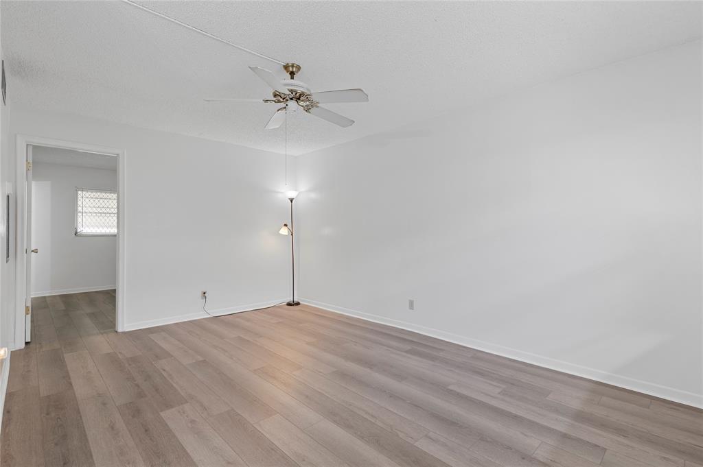 1230 Old Boynton Road, Unit 203 Boynton Beach, FL 33426 - Photo 12 of 25 wooden floor in an empty room