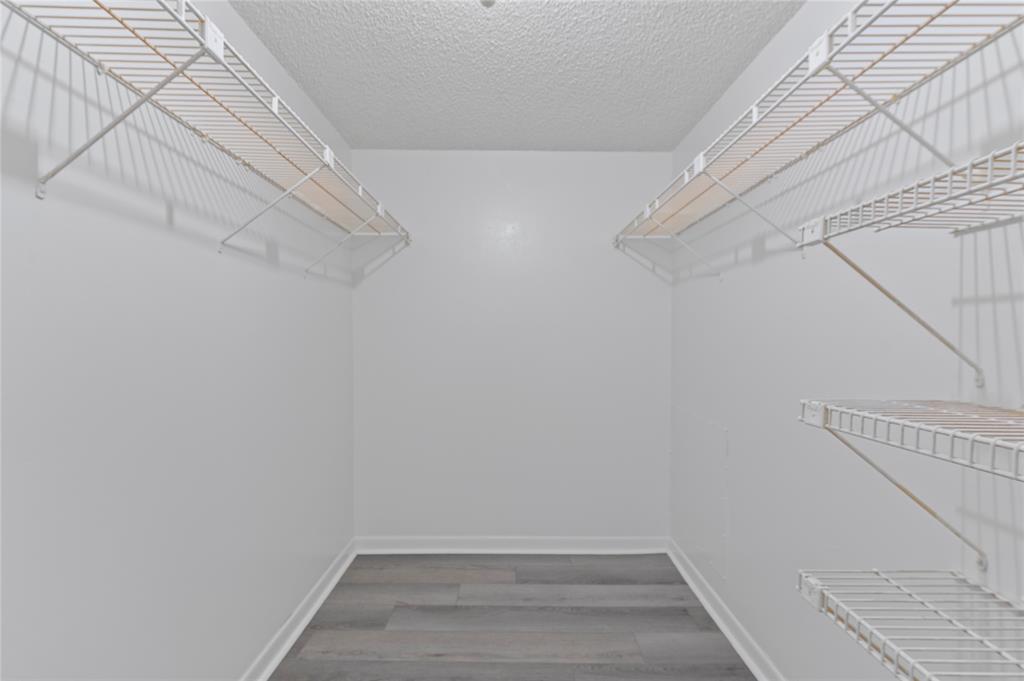 1230 Old Boynton Road, Unit 203 Boynton Beach, FL 33426 - Photo 15 of 25 a view of a room with racks on the wall