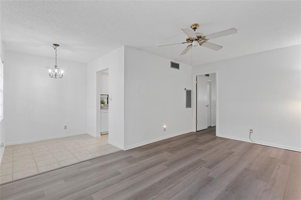 1230 Old Boynton Road, Unit 203 Boynton Beach, FL 33426 - Photo 10 of 25 wooden floor in an empty room with a window