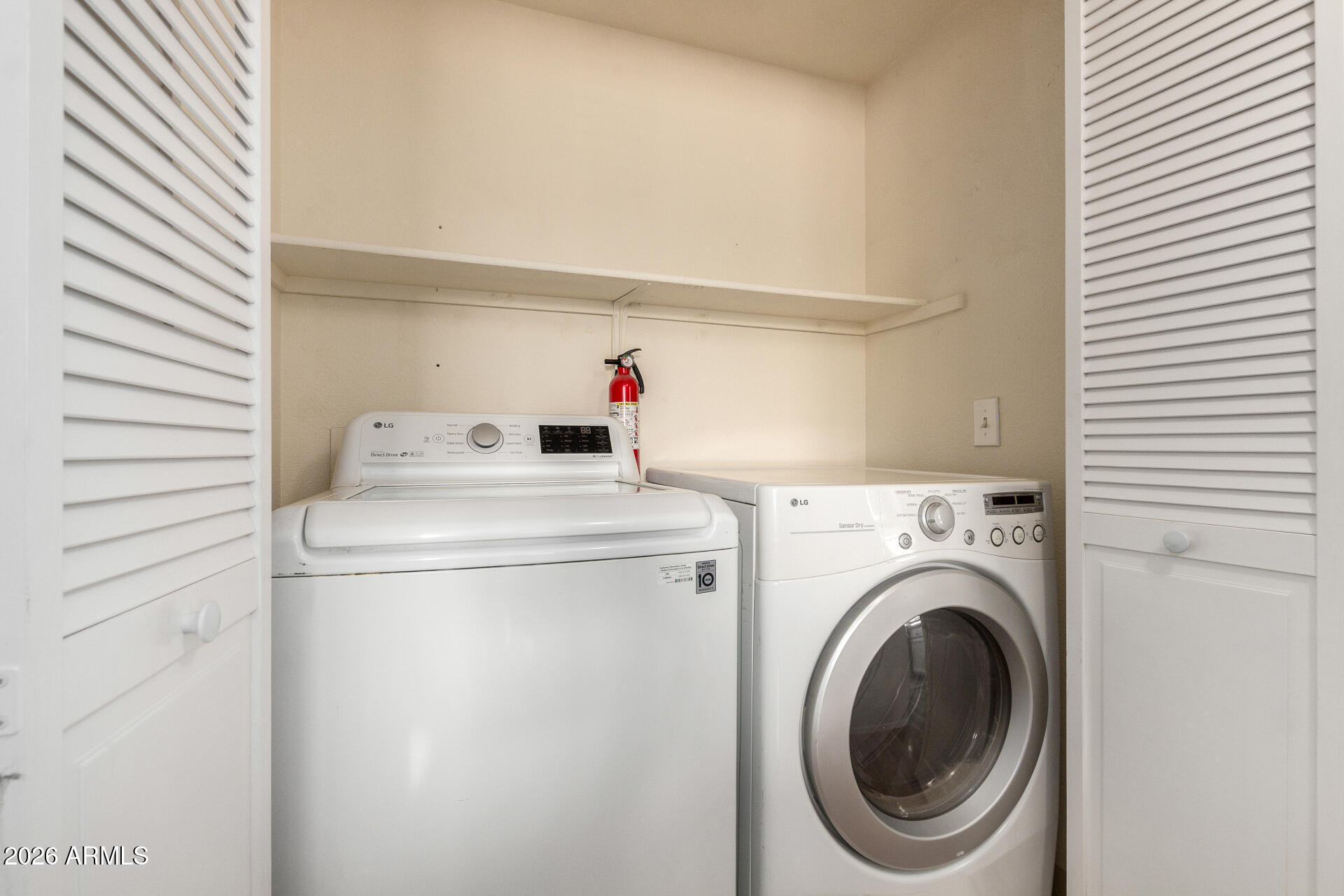 1825 West Ray Road, Unit 2098 Chandler, AZ 85224 - Photo 16 of 30 a utility room with dryer and washer
