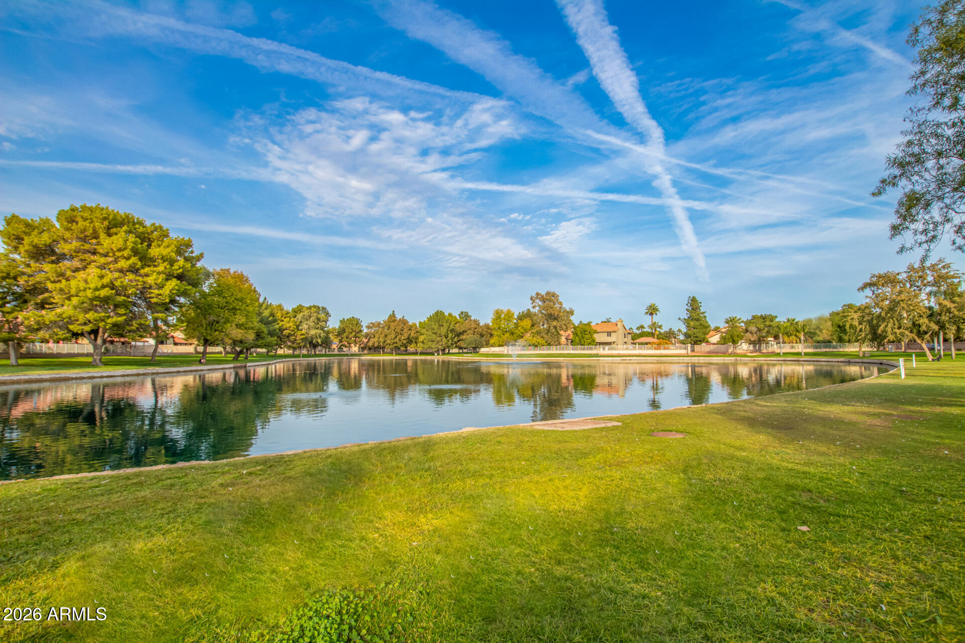1825 West Ray Road, Unit 2098 Chandler, AZ 85224 - Photo 23 of 30 a view of a lake with a houses