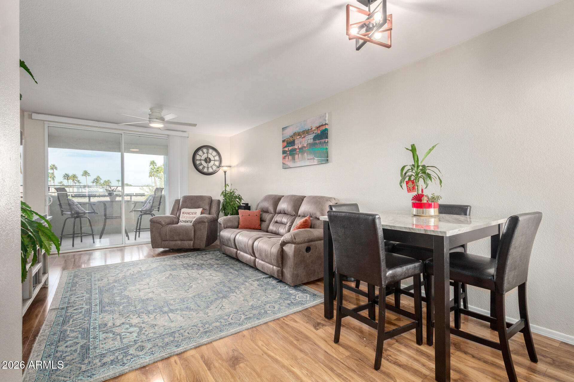 1825 West Ray Road, Unit 2098 Chandler, AZ 85224 - Photo 4 of 30 a living room with furniture and a wooden floor