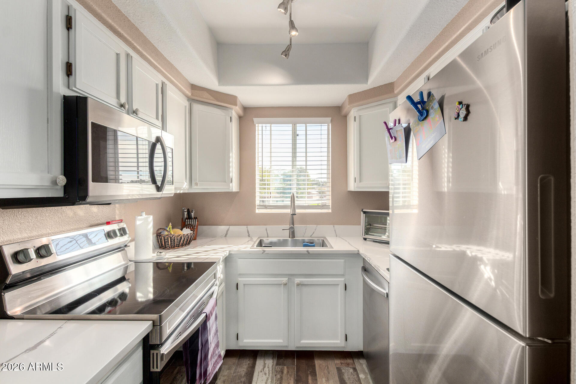 1825 West Ray Road, Unit 2098 Chandler, AZ 85224 - Photo 6 of 30 a kitchen with a sink stove and microwave
