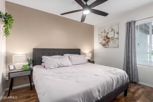 a bedroom with a bed and a window