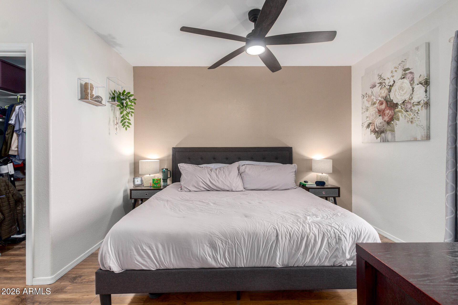 1825 West Ray Road, Unit 2098 Chandler, AZ 85224 - Photo 10 of 30 a bedroom with a bed and a chandelier