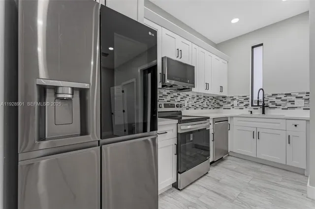 a kitchen with a stove and a sink