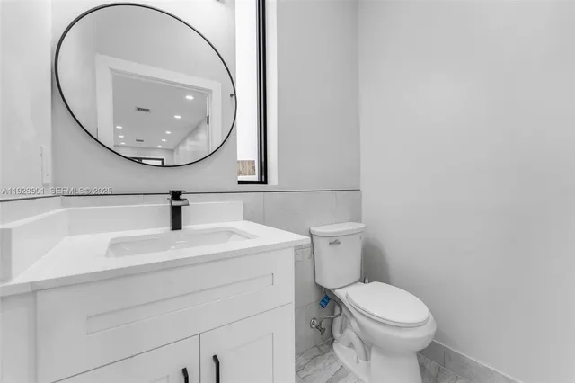 a view of a bathroom with a washer and dryer