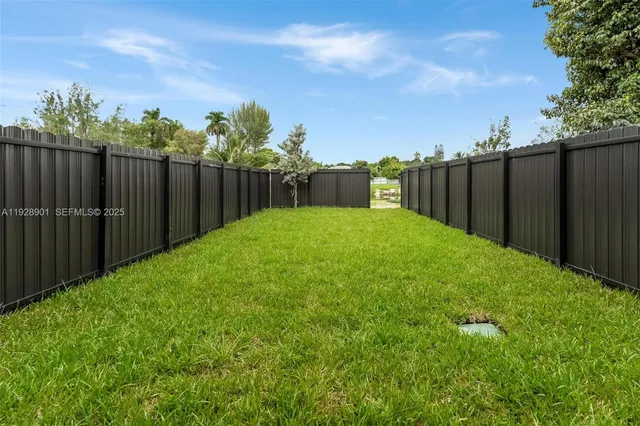 an aerial view of residential house with outdoor space and lake view