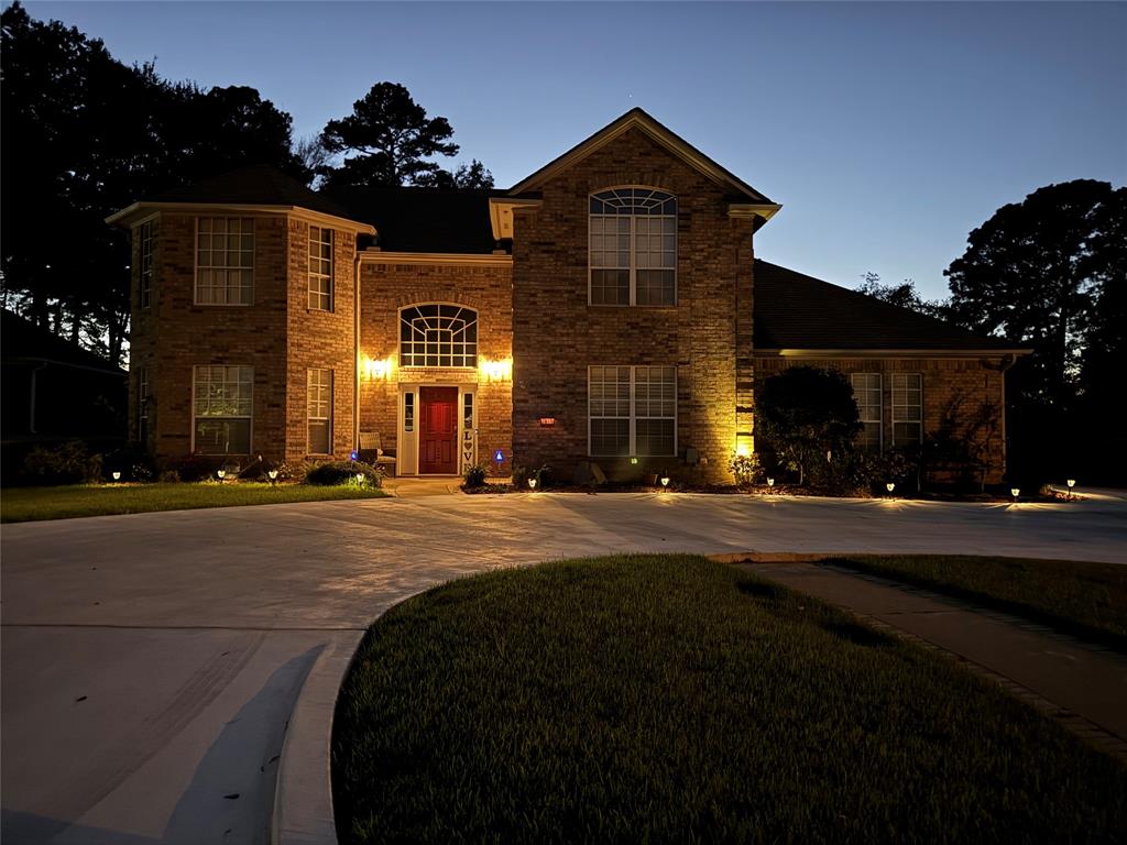 3815 Holly Ridge Drive Longview, TX 75605 - Photo 26 of 40 a front view of a house with a yard