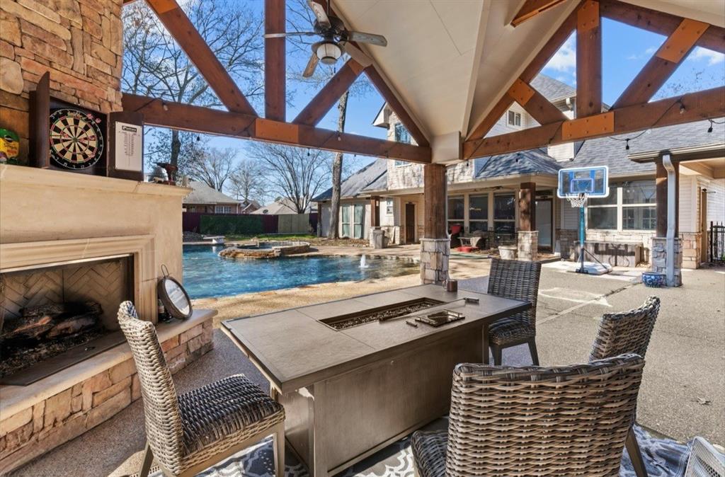 3815 Holly Ridge Drive Longview, TX 75605 - Photo 3 of 40 a dining room with furniture and a fireplace