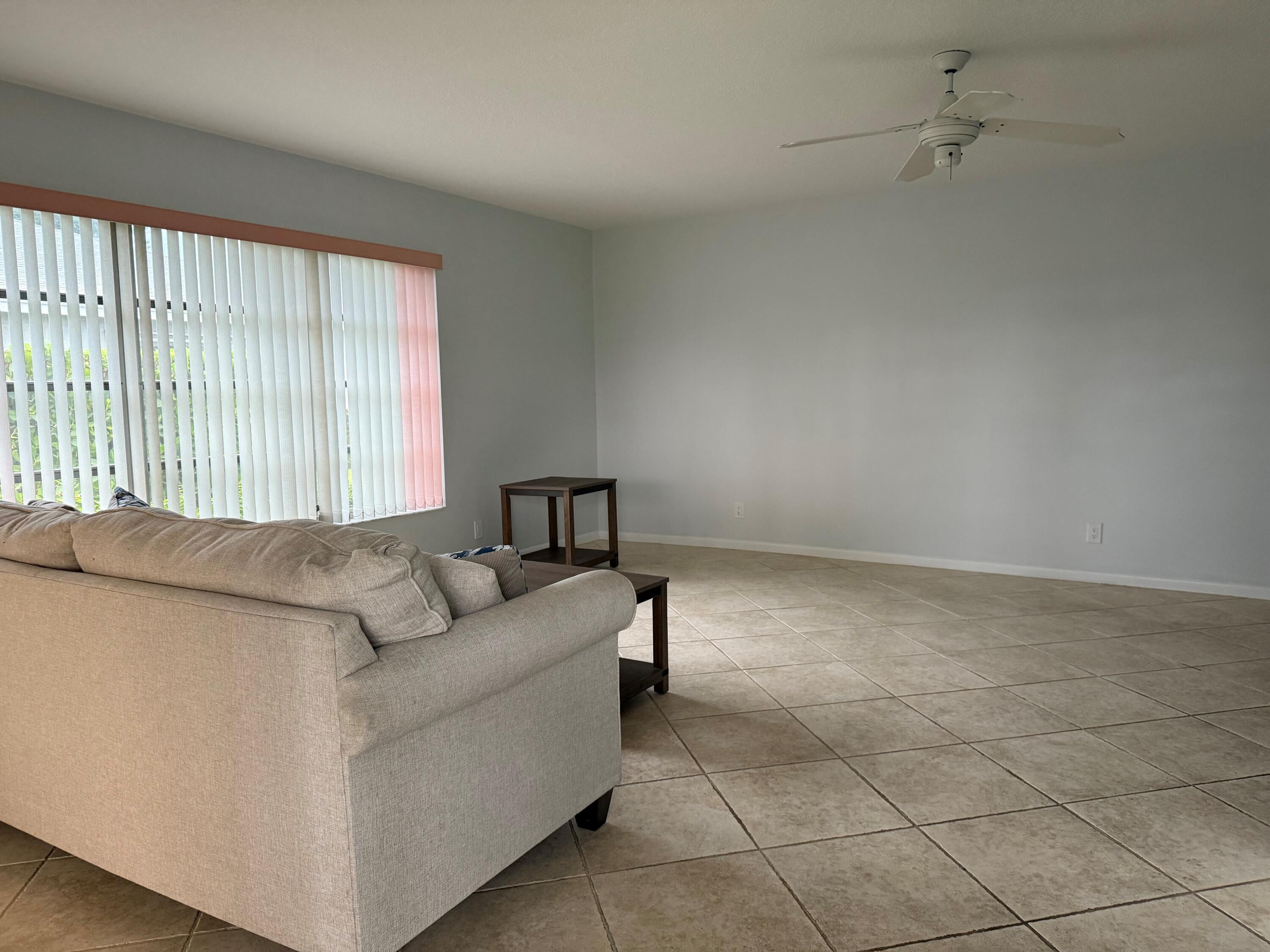 14676 Canalview Drive, Unit A Delray Beach, FL 33484 - Photo 7 of 33 a living room with furniture and a window