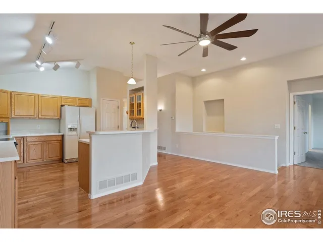 a view of a dining room with furniture wooden floor and chandelier