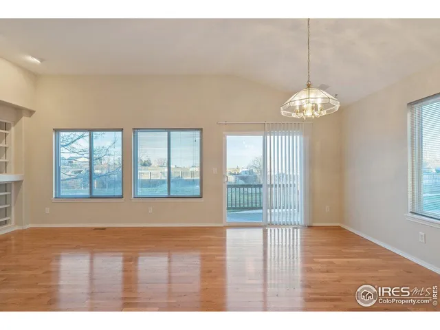 a bedroom with a bed and a chair