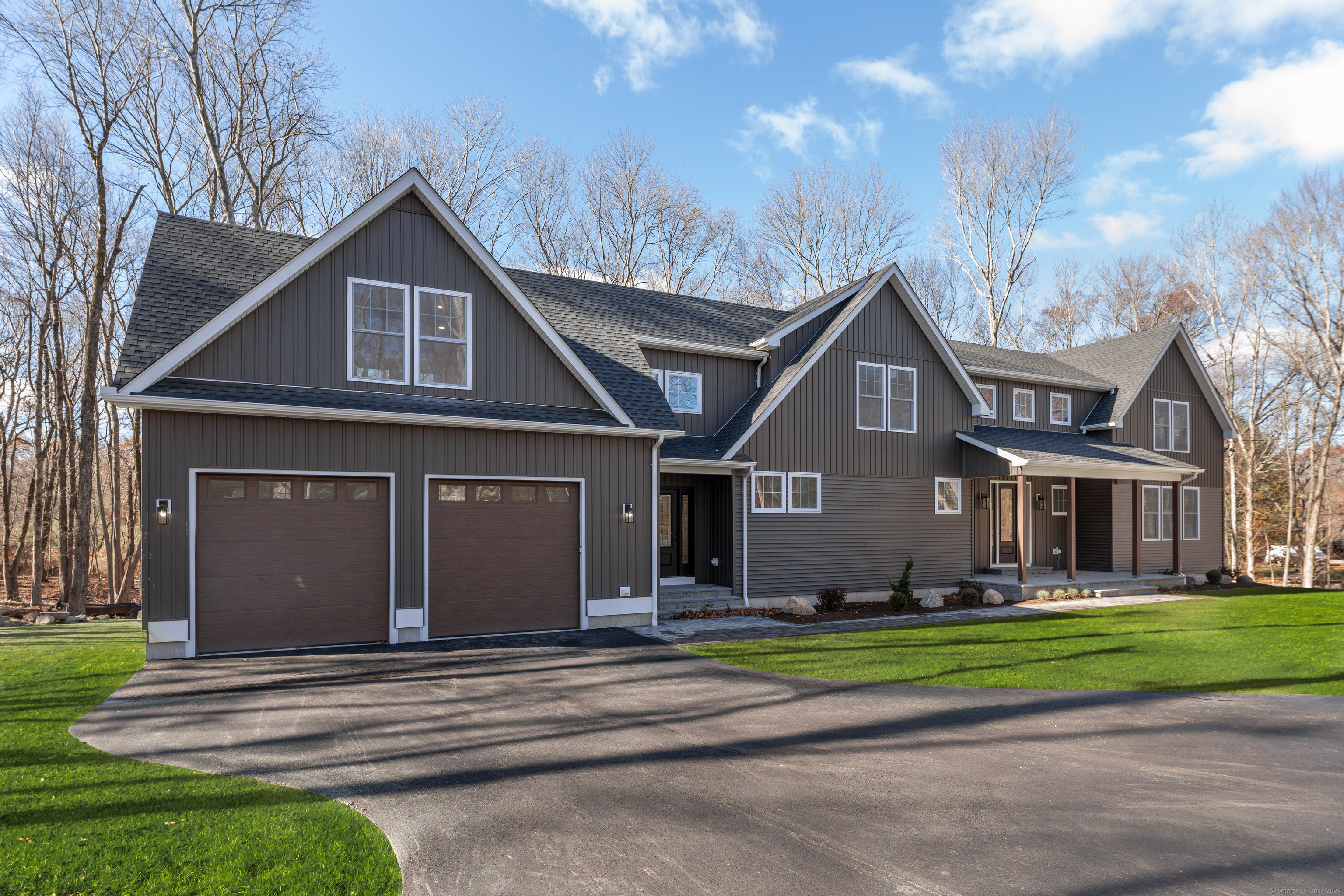 144 Ford Road Woodbridge, CT 06525 - Photo 1 of 1 a front view of a house with a yard