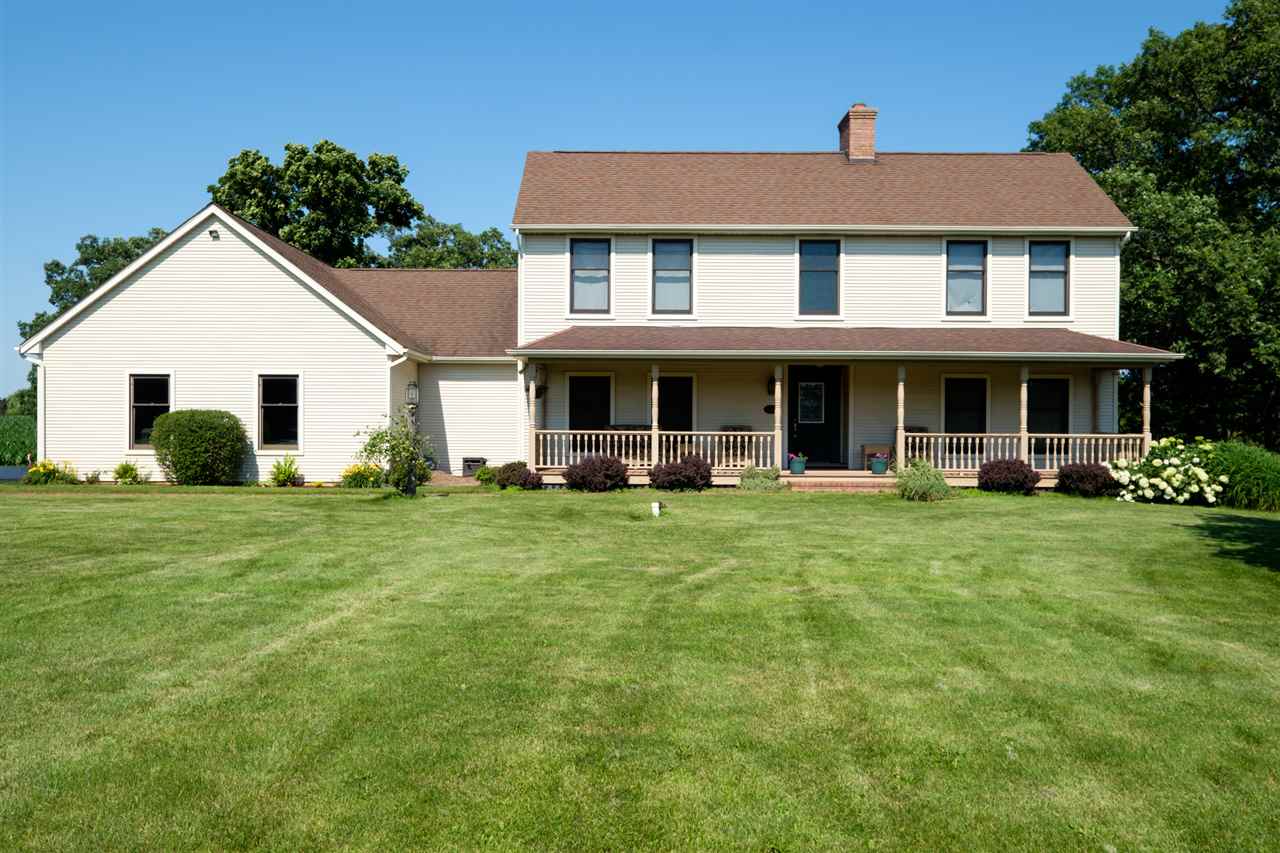12145 Caledonia Road Belvidere, IL 61008 - Photo 1 of 25 a view of a yard in front of house