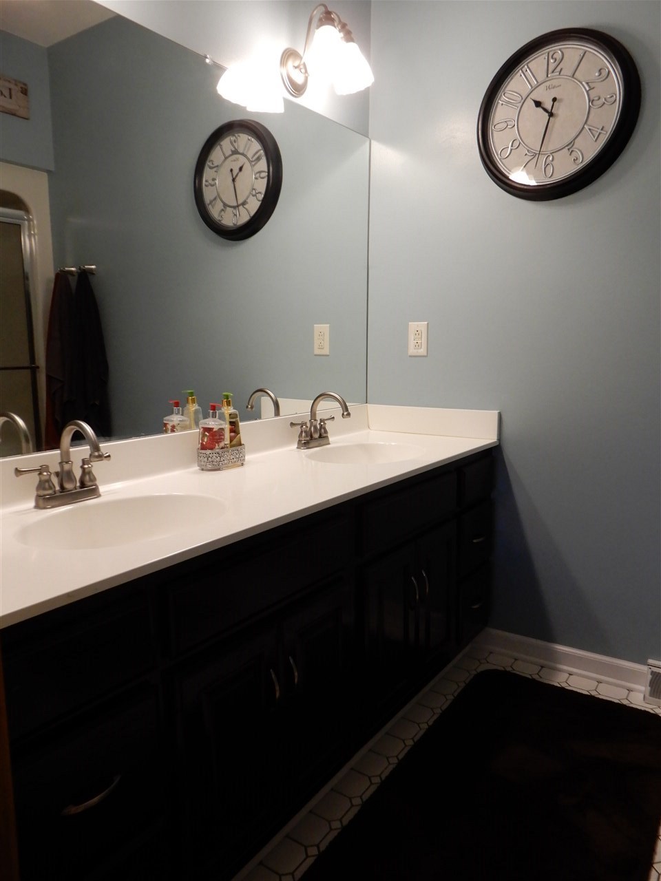 12145 Caledonia Road Belvidere, IL 61008 - Photo 12 of 25 a bathroom with a sink and a mirror