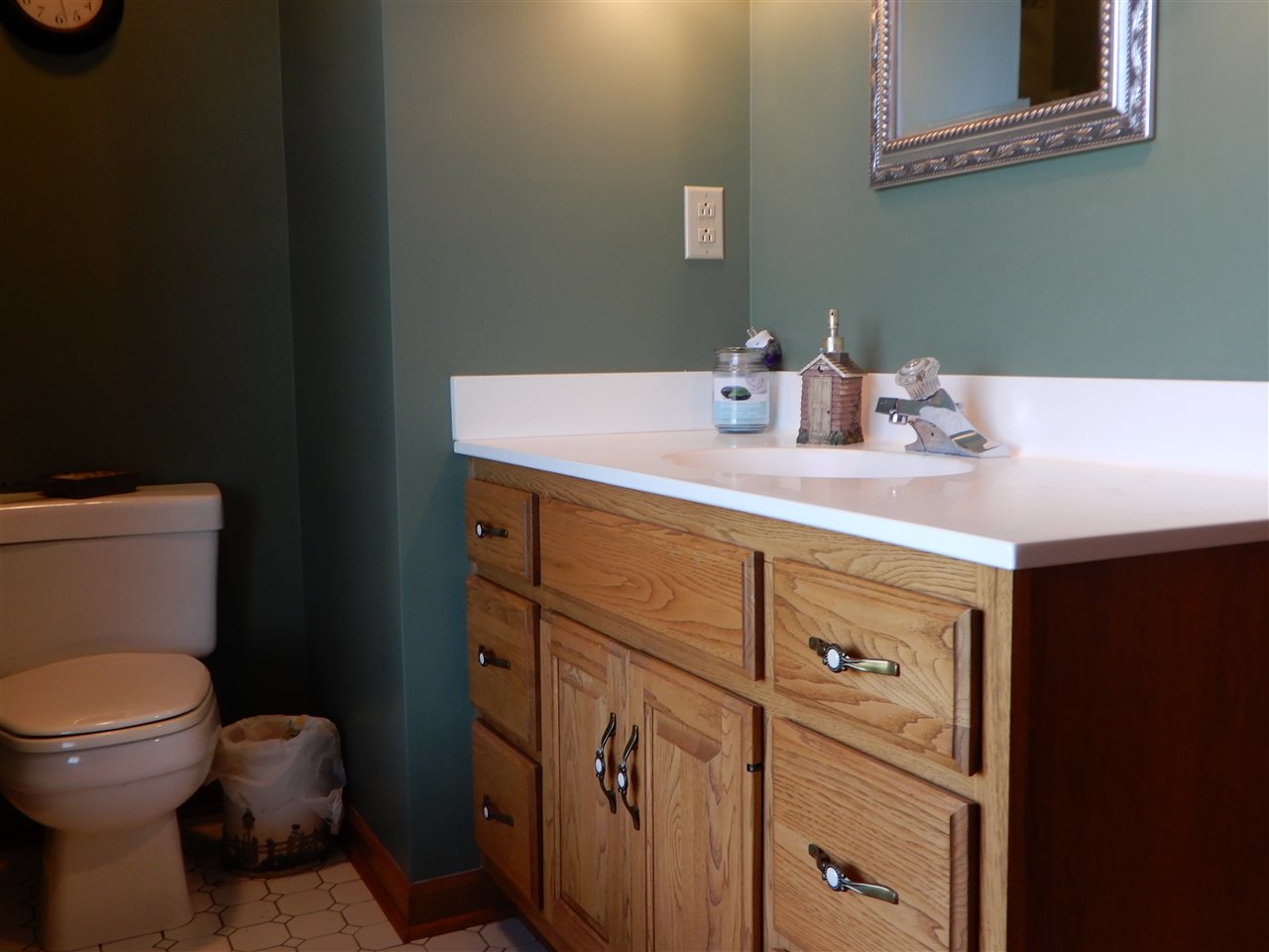 12145 Caledonia Road Belvidere, IL 61008 - Photo 15 of 25 a bathroom with a toilet sink vanity and mirror