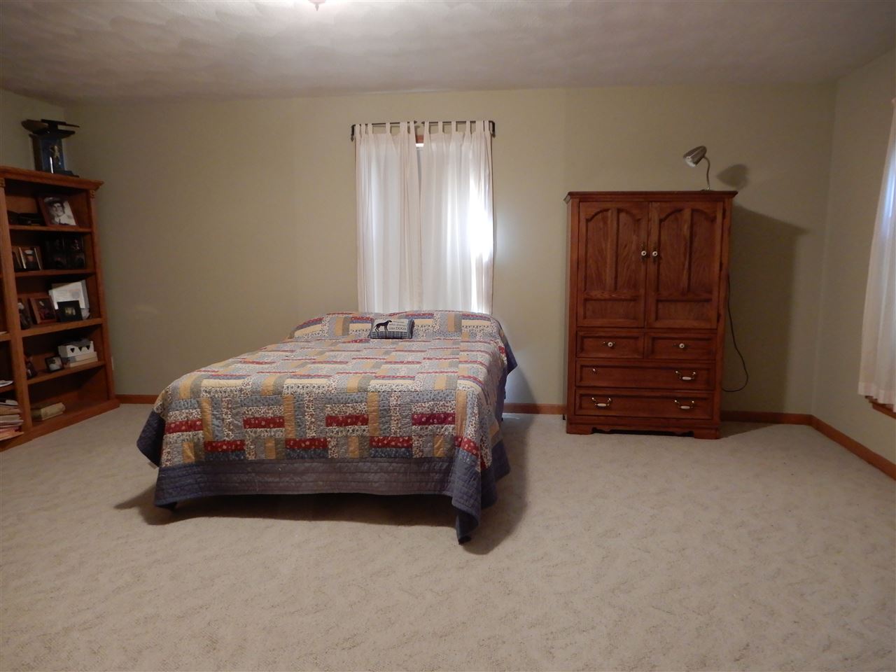 12145 Caledonia Road Belvidere, IL 61008 - Photo 16 of 25 a bedroom with a bed and a cabinets