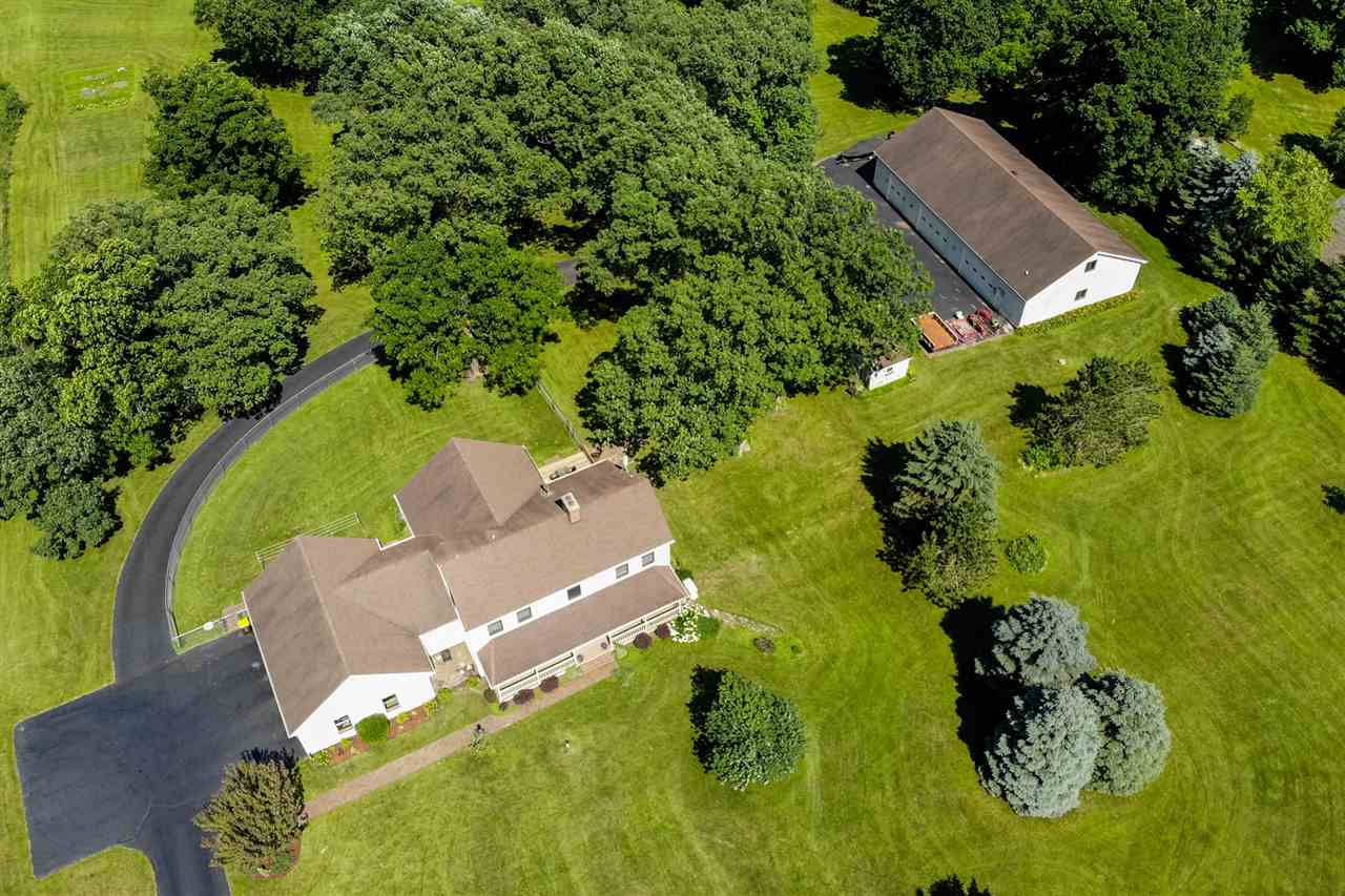 12145 Caledonia Road Belvidere, IL 61008 - Photo 25 of 25 an aerial view of a house with a garden