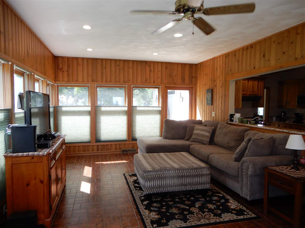 12145 Caledonia Road Belvidere, IL 61008 - Photo 6 of 25 a living room with furniture and a flat screen tv