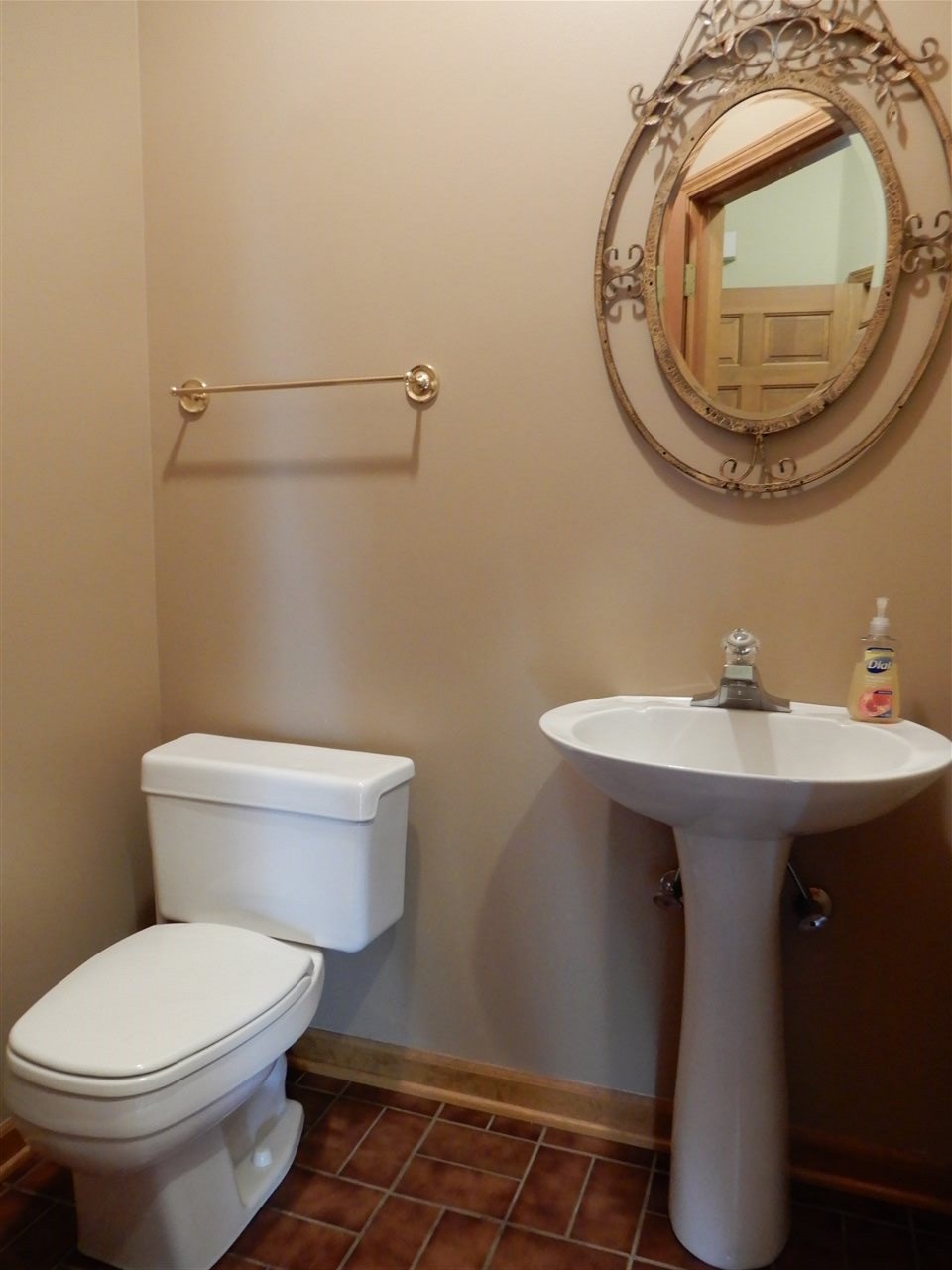 12145 Caledonia Road Belvidere, IL 61008 - Photo 8 of 25 a bathroom with a sink toilet and mirror