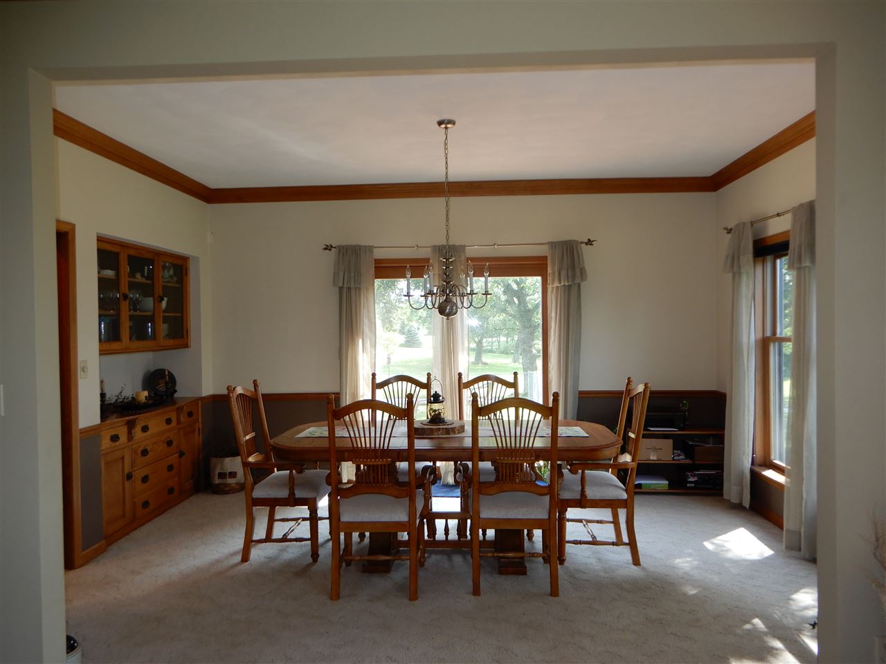 12145 Caledonia Road Belvidere, IL 61008 - Photo 10 of 25 a view of a dining room with furniture and chandelier