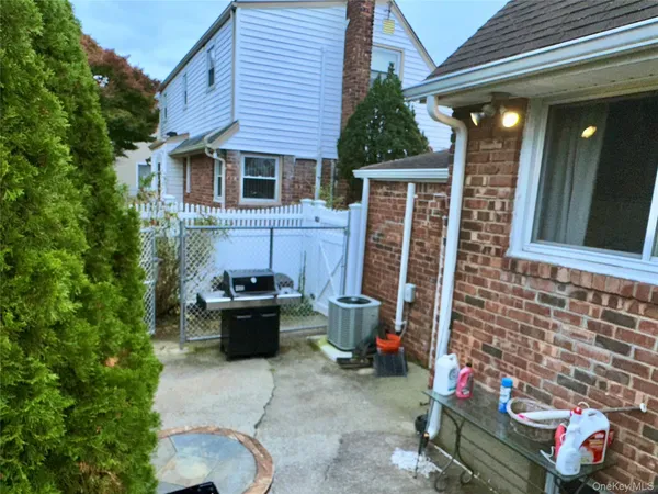 a view of a patio with couches chairs and potted plants