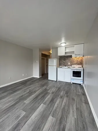 a view of a kitchen with a microwave and stove