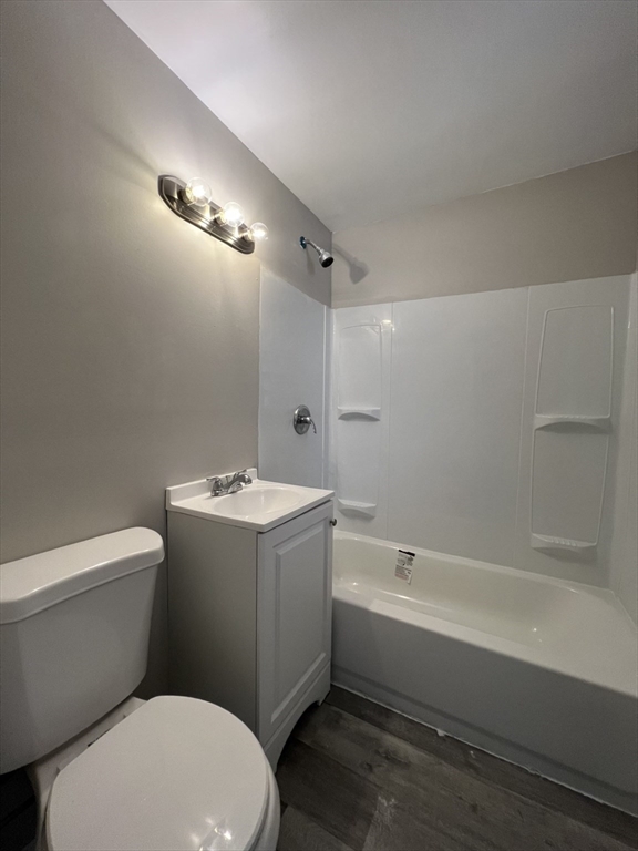 1159 Dwight Street, Unit O Holyoke, MA 01040 - Photo 3 of 3 a bathroom with a sink a toilet and shower