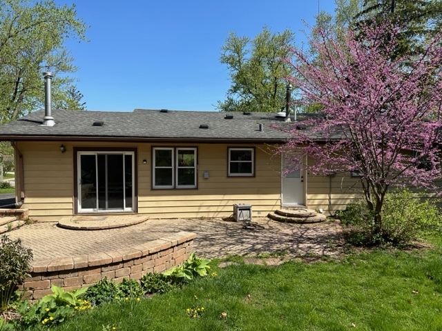 2217 West Palatine Road Inverness, IL 60067 - Photo 1 of 17 a front view of a house with garden