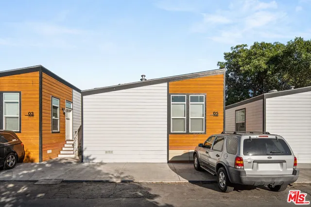 a view of a car park in front of house