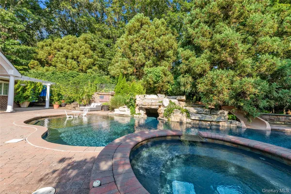 a view of a swimming pool with chairs