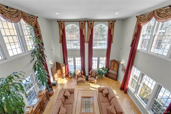 a view of living room with furniture and floor to ceiling windows